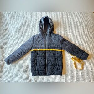 Under Armour black puffer jacket with hood. Size YMD.